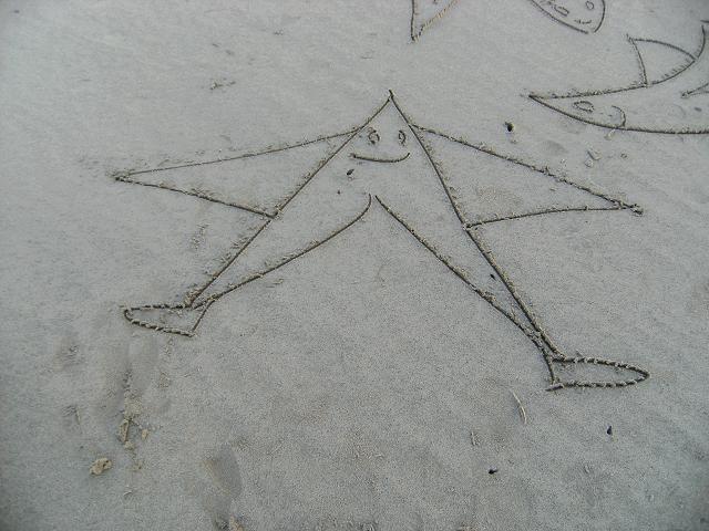 Sand Drawing and Standing Stone Images Beach Art Images